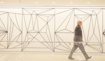 Business man walking down a hall