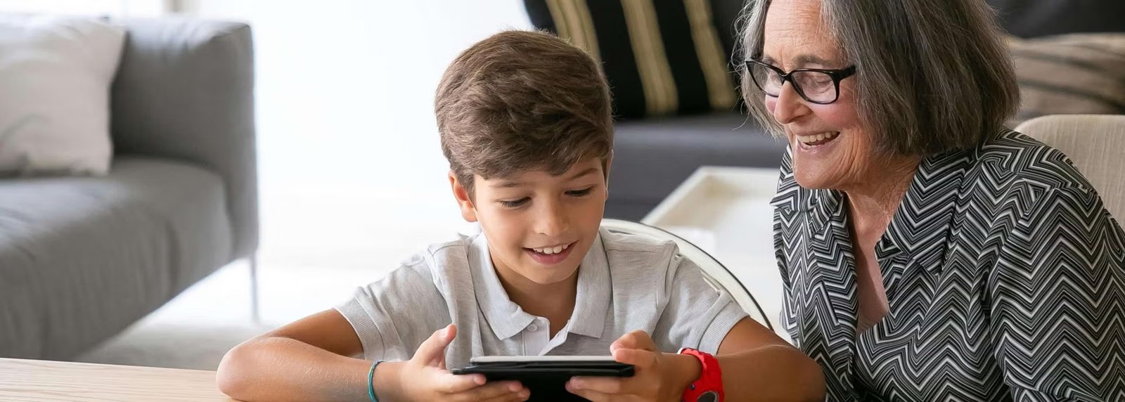 Grandson and grandmother at a table